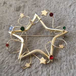 Silver holiday star gemstone chest pin brooch
